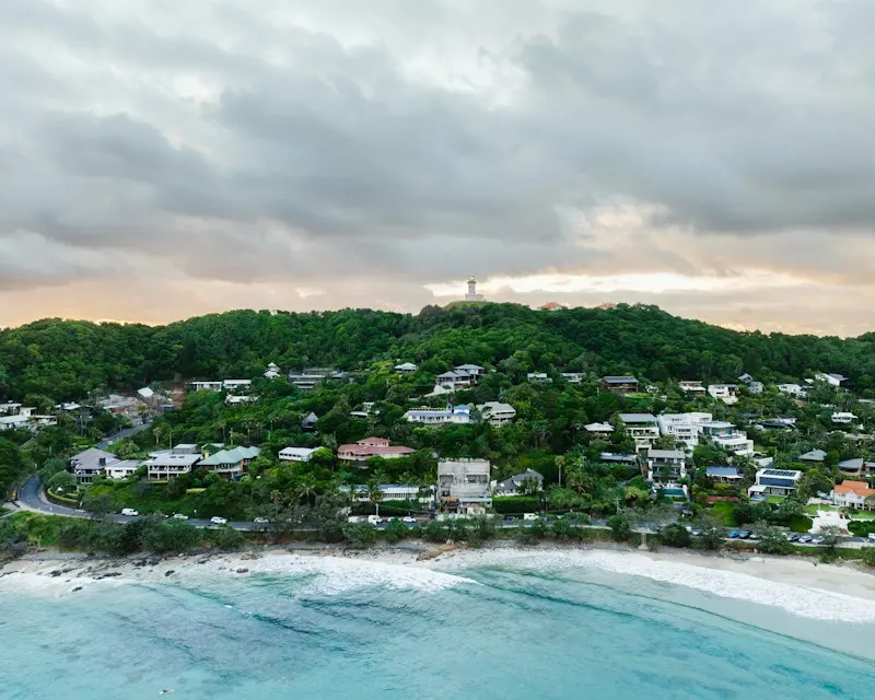 Wategos Beach and the houses on the hill behind it, from the air
